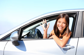Smiling girl with car keys